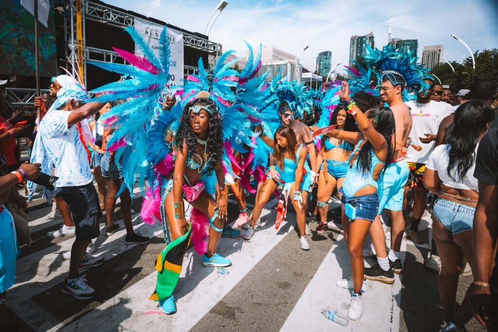 Masqueraders on the Lakeshore at the 2023 Toronto Caribbean Carnival with Sunlime Mas. Register to play mas at Toronto Carnival with Sunlime Mas.